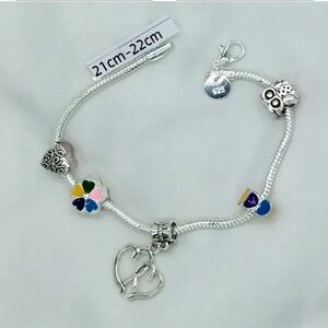 Silver Bracelet with 5 charms of your choice.Pick 8.5”or 8.75”long and a clasp.